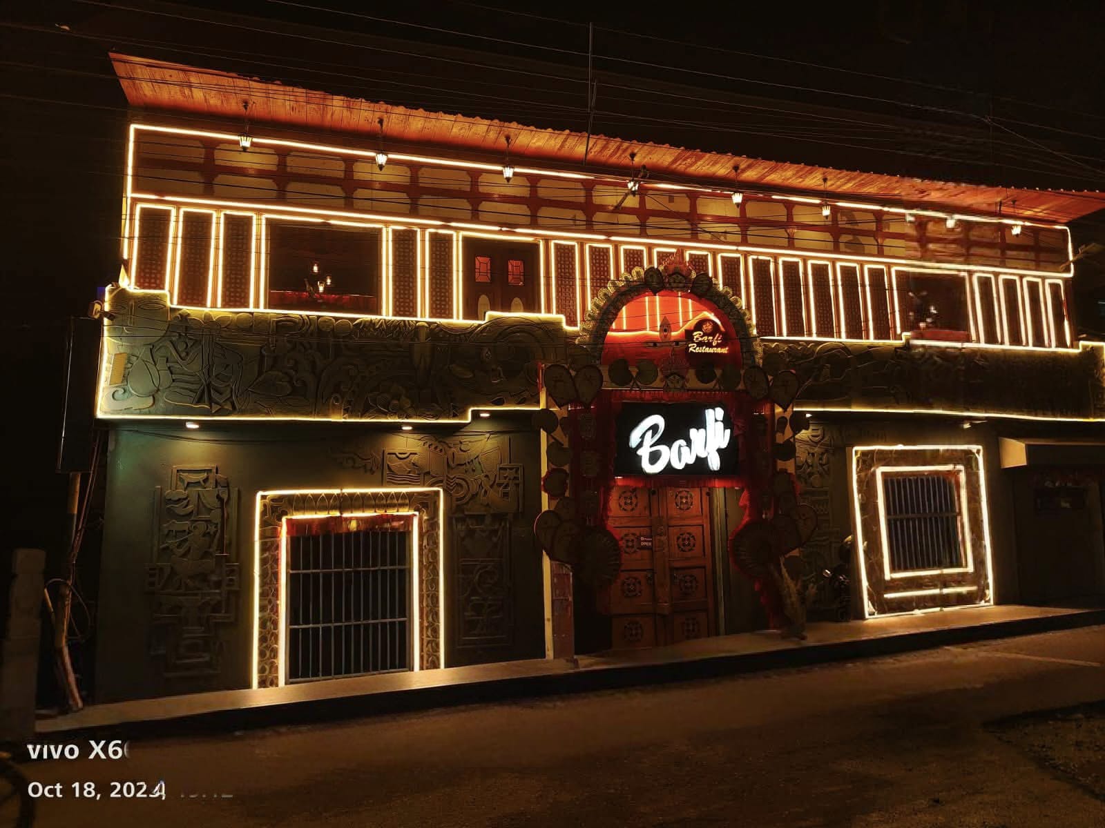 Barfi restaurant lit up at night